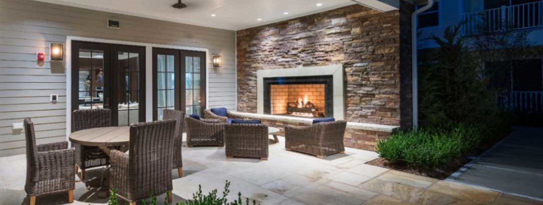 Outdoor fireplace and seating at The Point at Merrimack River
