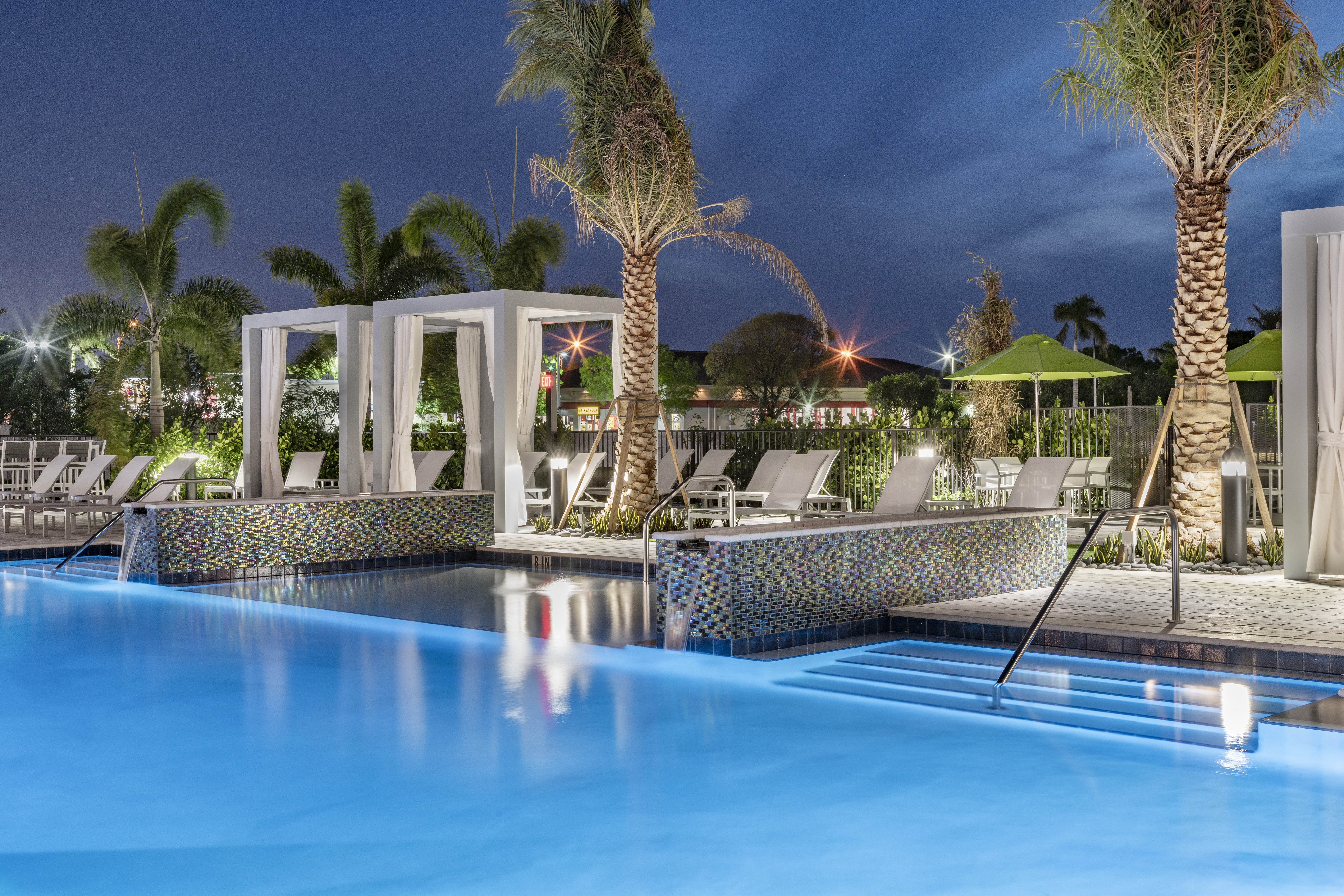 Outdoor pool and cabanas at The Point at Doral