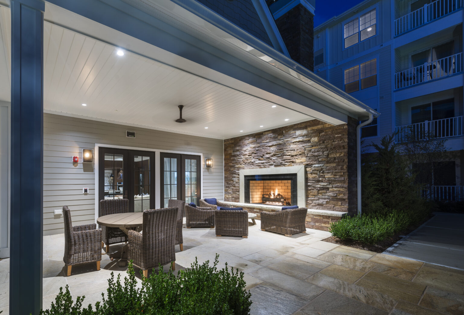 Outdoor fireplace with seating at The Point at Merrimack River