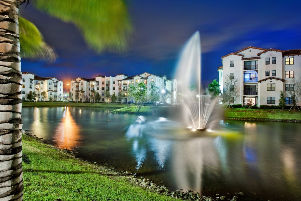 Outdoor area with large lake and fountain at The Point at Lakeside