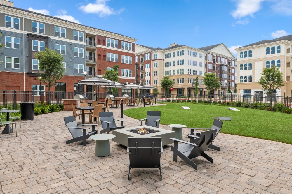 Outside courtyard with chairs and a firepit at The Point at Fairfax